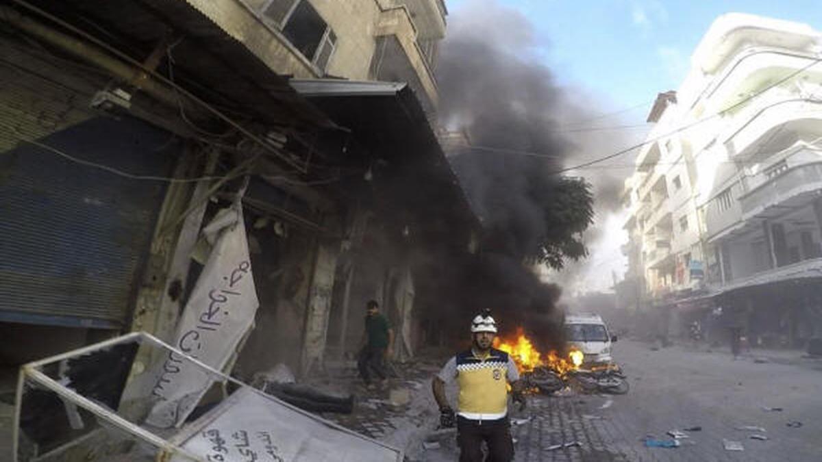 Reports say dozens have been killed and wounded as drone strikes hit a Syrian military ceremony